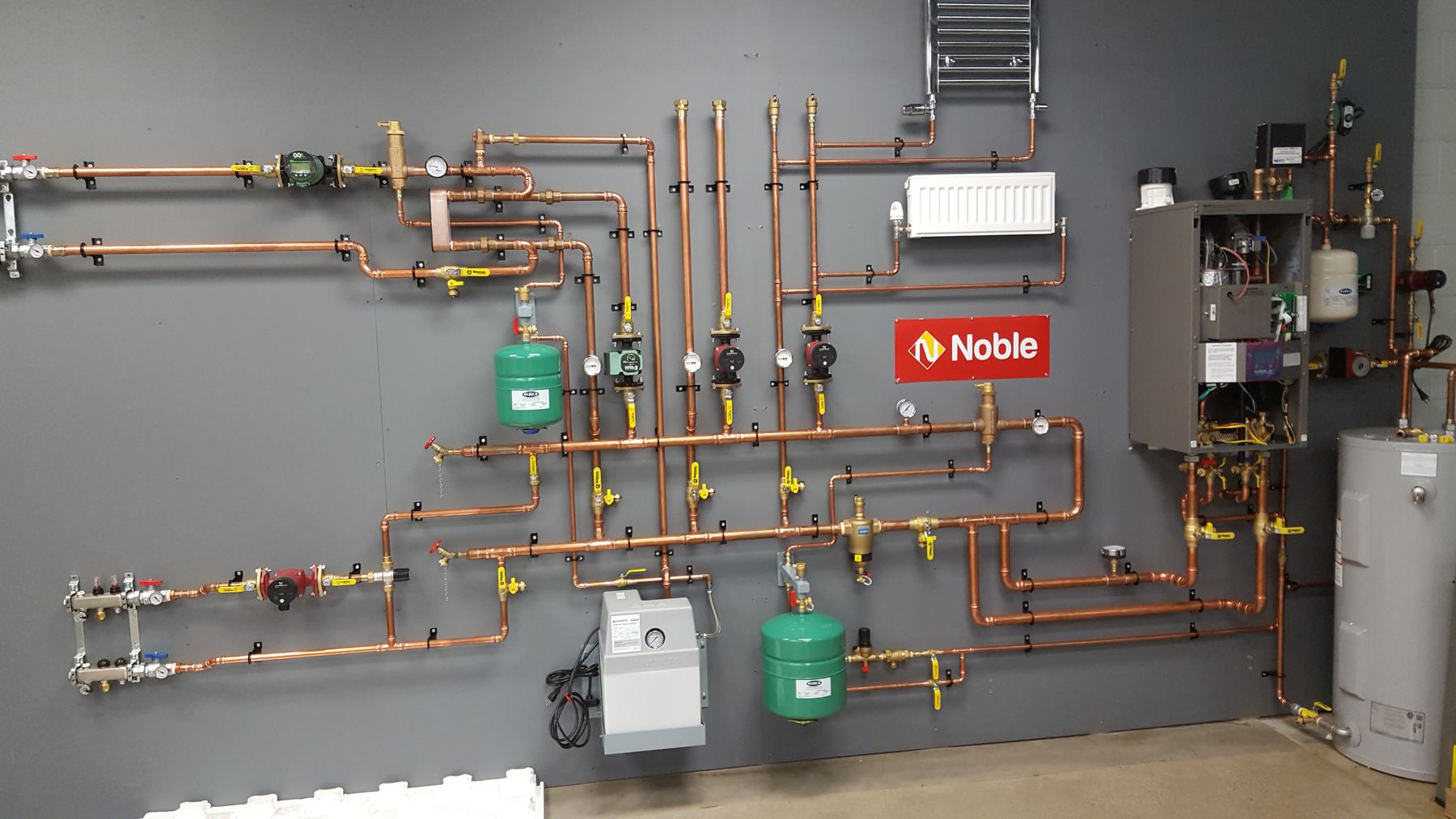 Copper hydronic heating board with circulator pumps and boiler